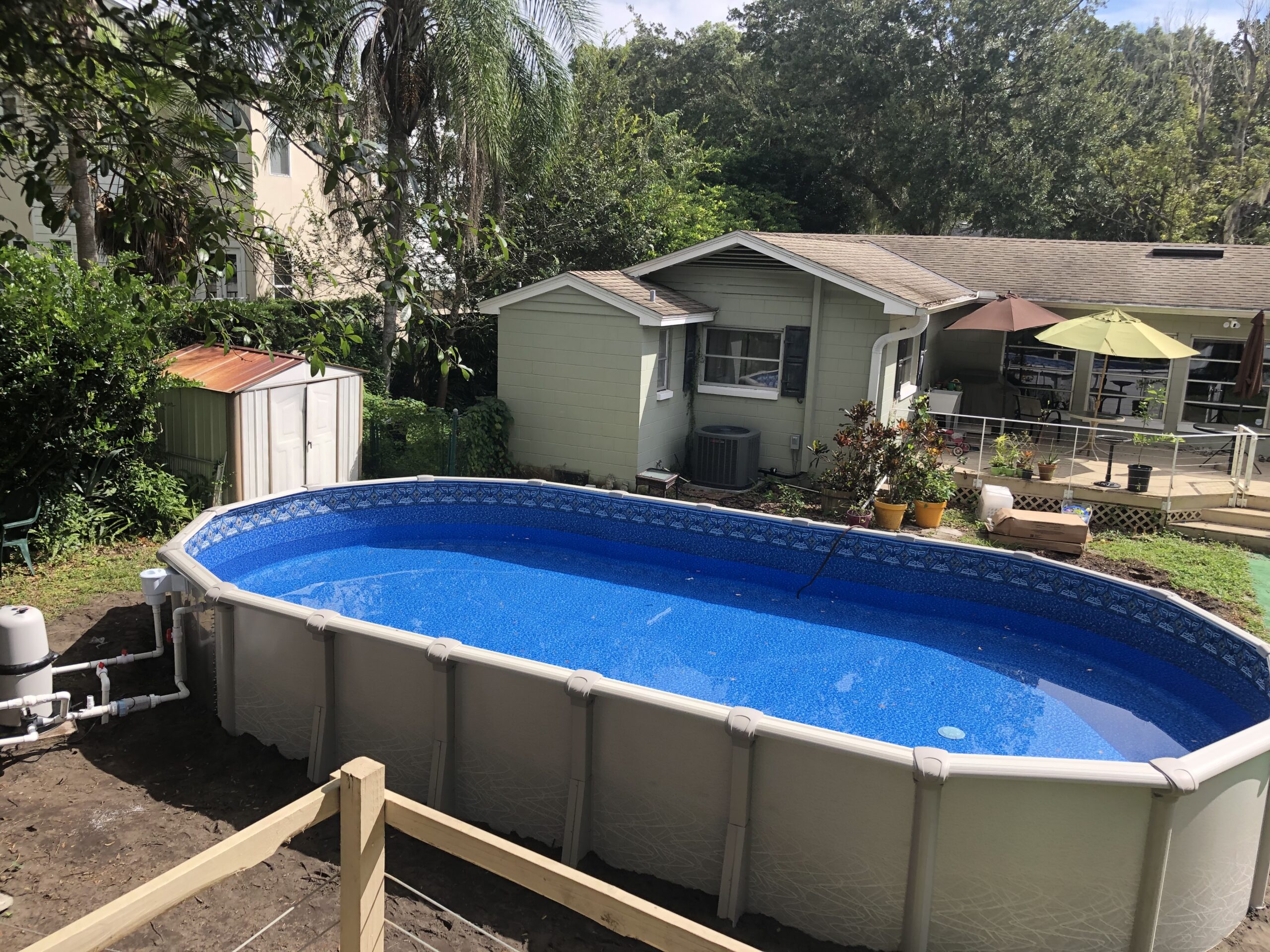 Oval above ground pool installed with main drain in Ocoee, Florida