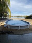 15x30 Oval above ground pool semi-inground in Deltona, Florida