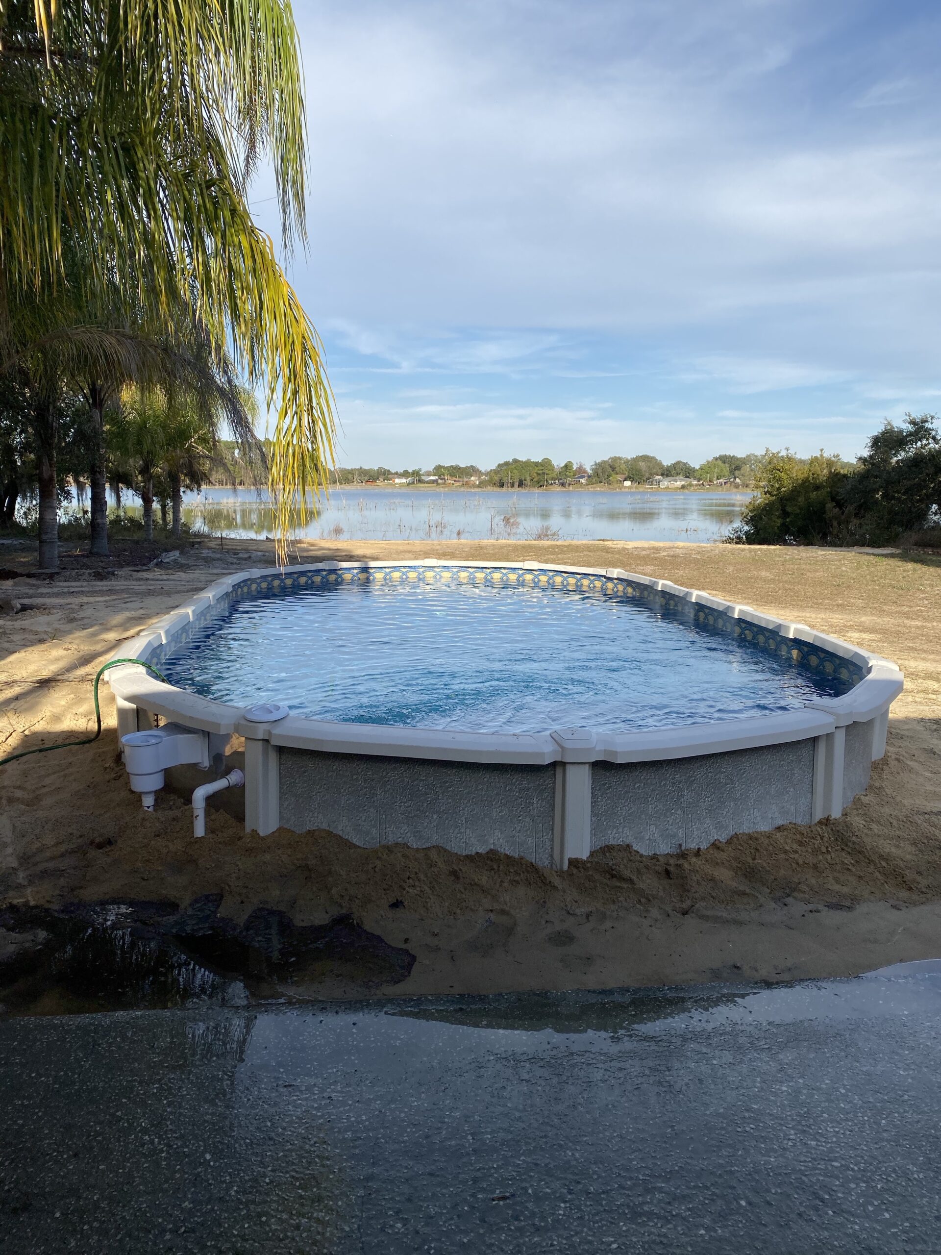 15x30 Oval above ground pool semi-inground in Deltona, Florida