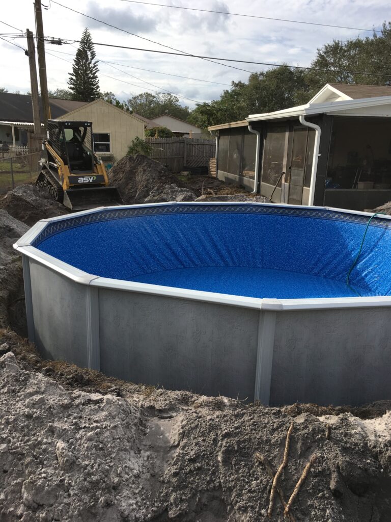 18' round Above ground pool semi-inground in Orlando filling
