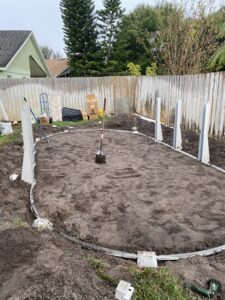 12'x24' Oval above ground pool before the wall is installed into the bottom track