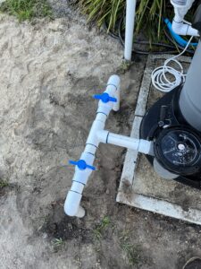 PVC with two valves in front of the pump for an above ground pool